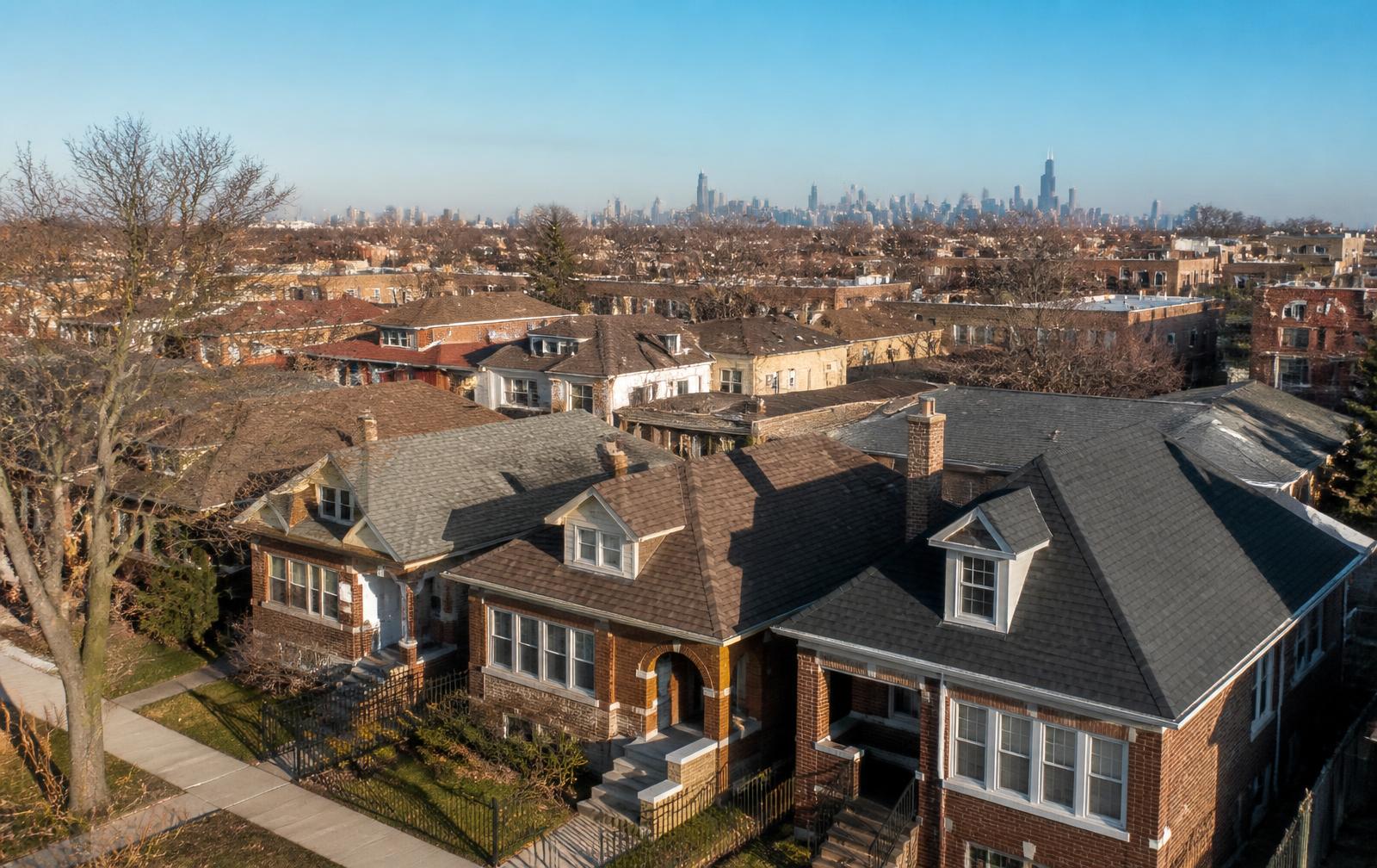 Chicago residential neighborhood with brick bungalows and shingle roofs at sunrise